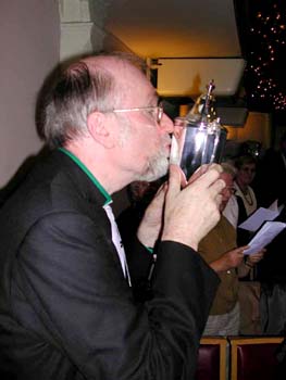 Rev. Martin Camroux kisses the cup