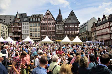 At One Table, Frankfurt (plaza view with buildings)